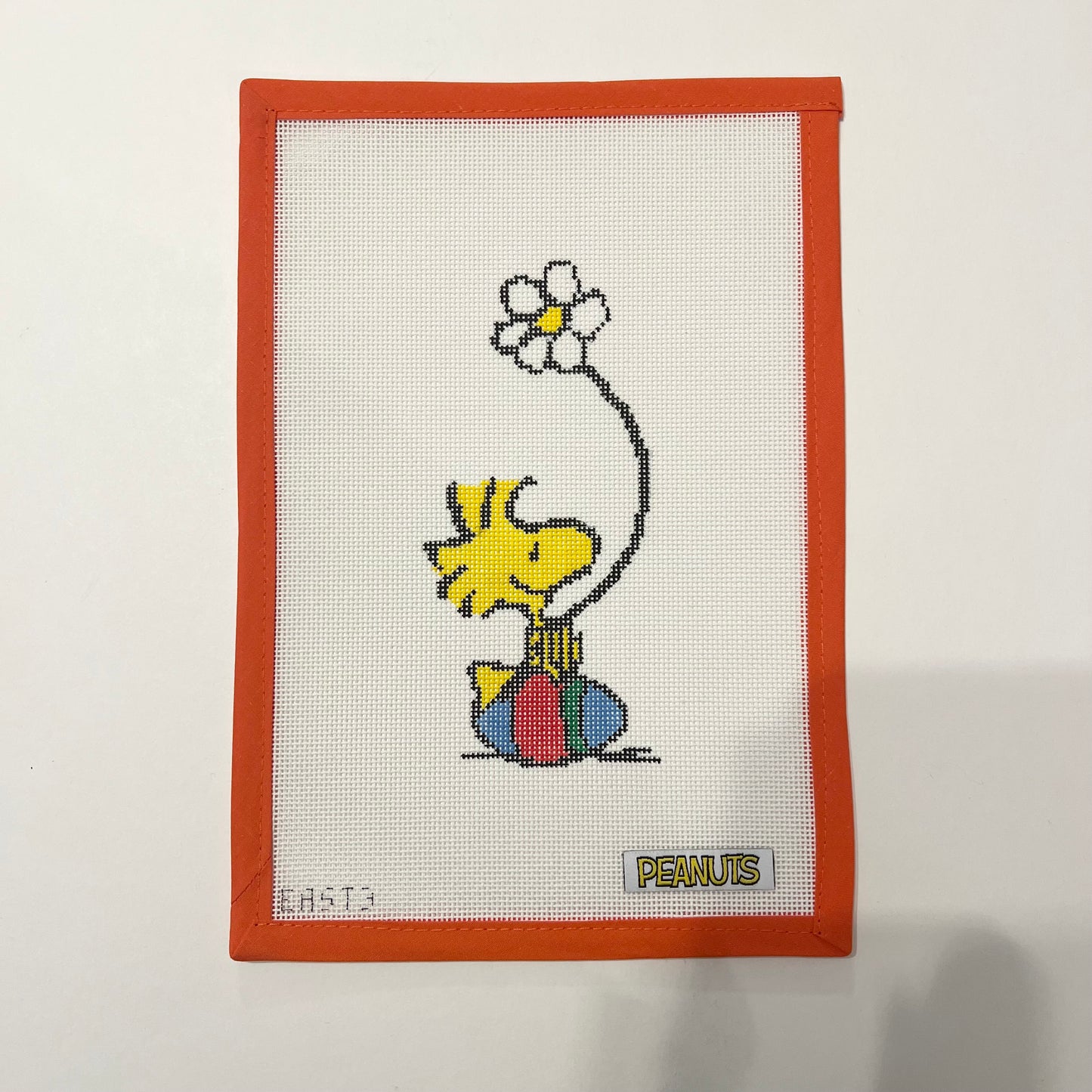 Woodstock sitting on Easter Egg