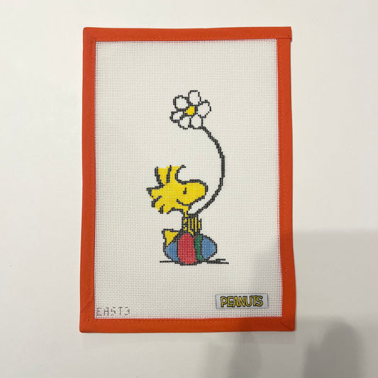 Woodstock sitting on Easter Egg